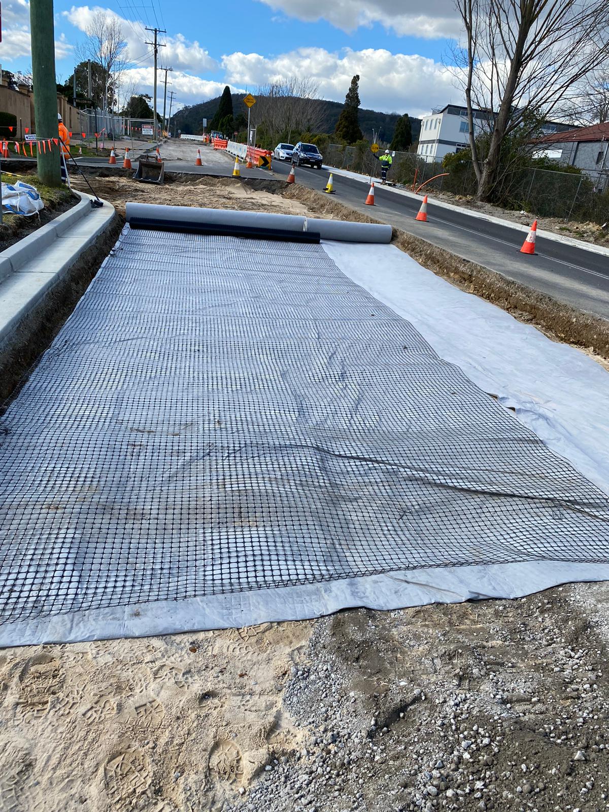 Geogrid installation for reinforcing pavements